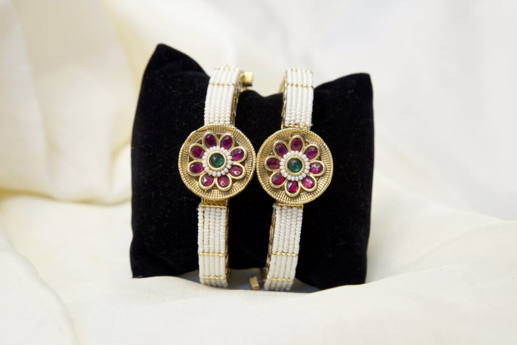 Traditional Gold-Plated Bangles with Floral Ruby and Emerald Design