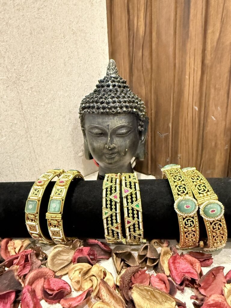 Traditional Golden Bangles Set with Swastik Design
