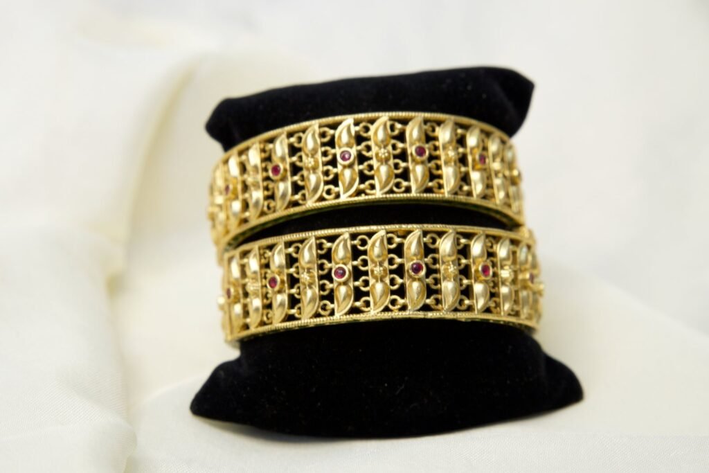 Traditional Gold-Plated Temple Kada Bangles with Red Stone Embellishments (Set of 2)