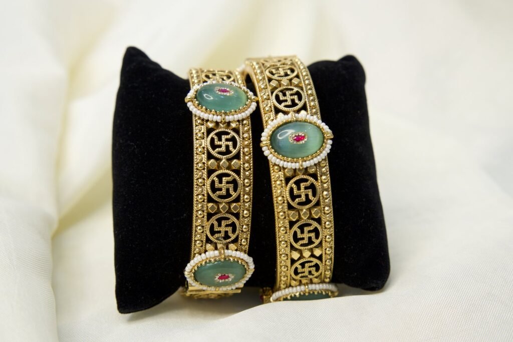 Traditional Gold-Toned Bangles with Green Stone Embellishments