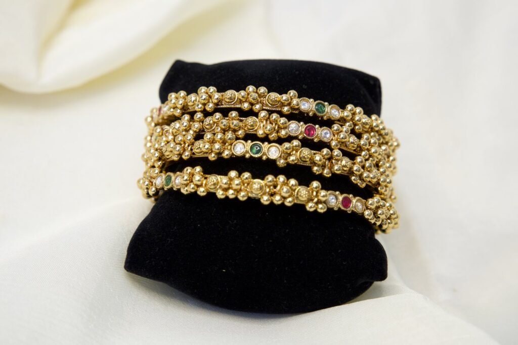 Traditional Gold-Toned Bangles Set with Multicolor Stone Embellishments (Set of 4)