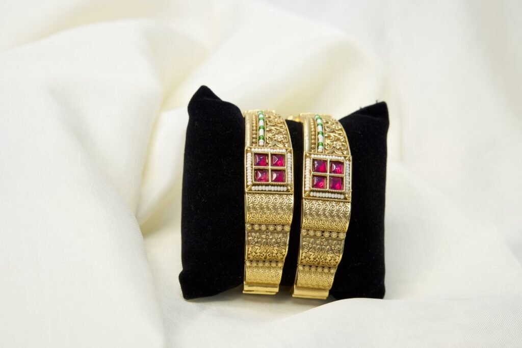 Elegant Gold-Plated Bangles with Pink Stone Embellishments