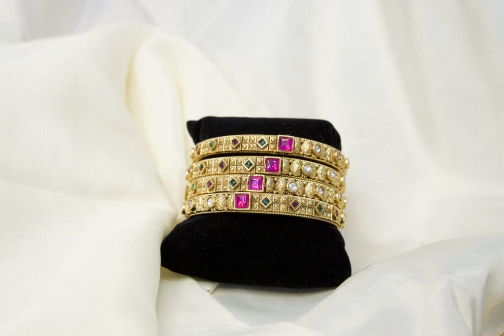 Traditional Gold-Plated Bangles Set with Pink Stone Embellishments