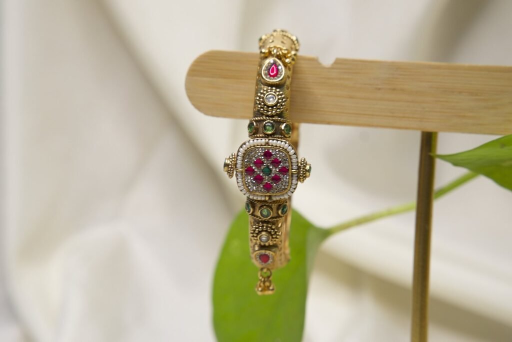 Traditional Gold-Toned Kundan Bangle with Pink & Green Stones