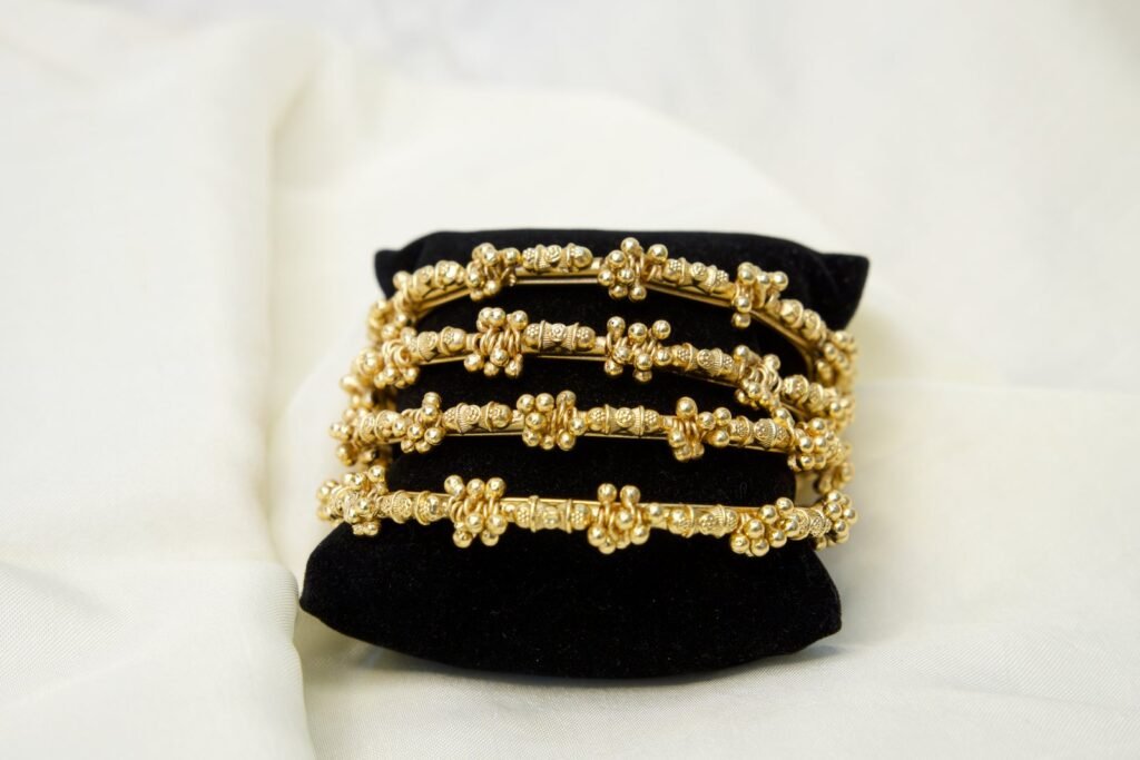 Gold-Toned Twisted Wire Bangle Set (Set of 4)