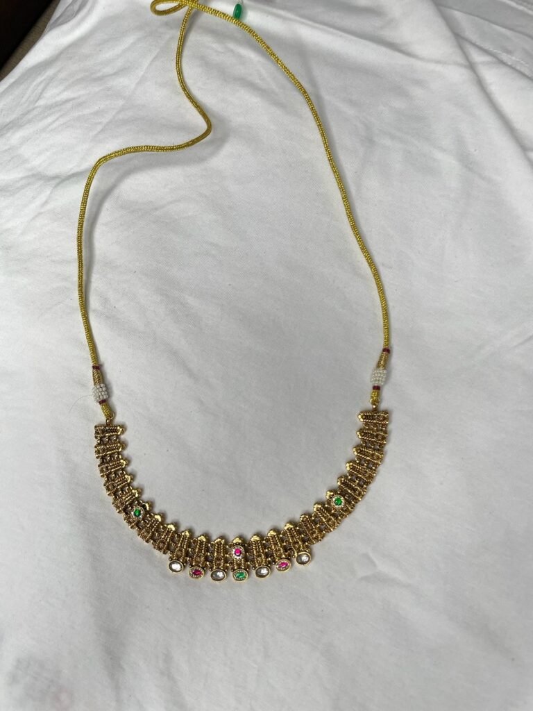 Gold-Toned Necklace and Jhumka Earrings Set with Pink and Green Stone Embellishments