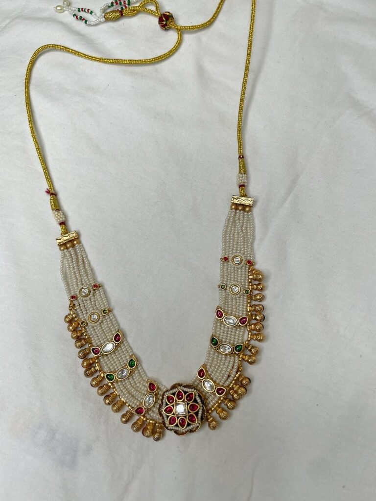 Traditional Pearl Beaded Necklace Set with Kundan and Gemstone Detailing