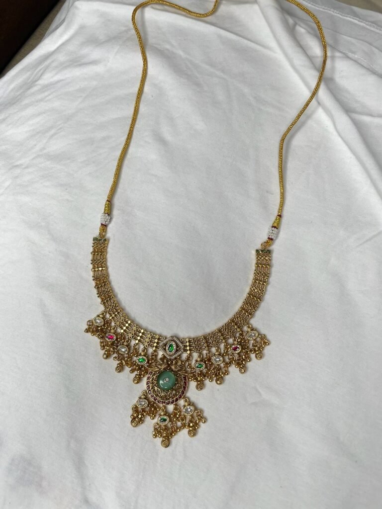 Traditional Gold-Plated Kundan Necklace Set with Green Stones and Matching Earrings