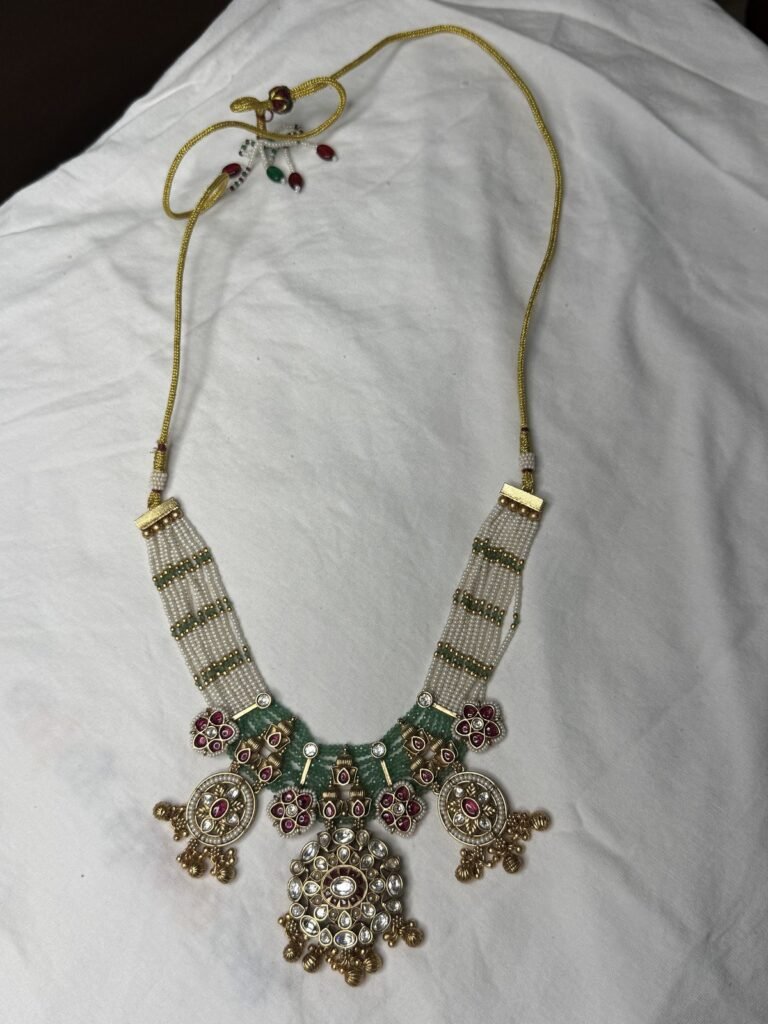 Traditional Kundan Style Pearl Beaded Necklace and Earring Set with Red and Green Stones
