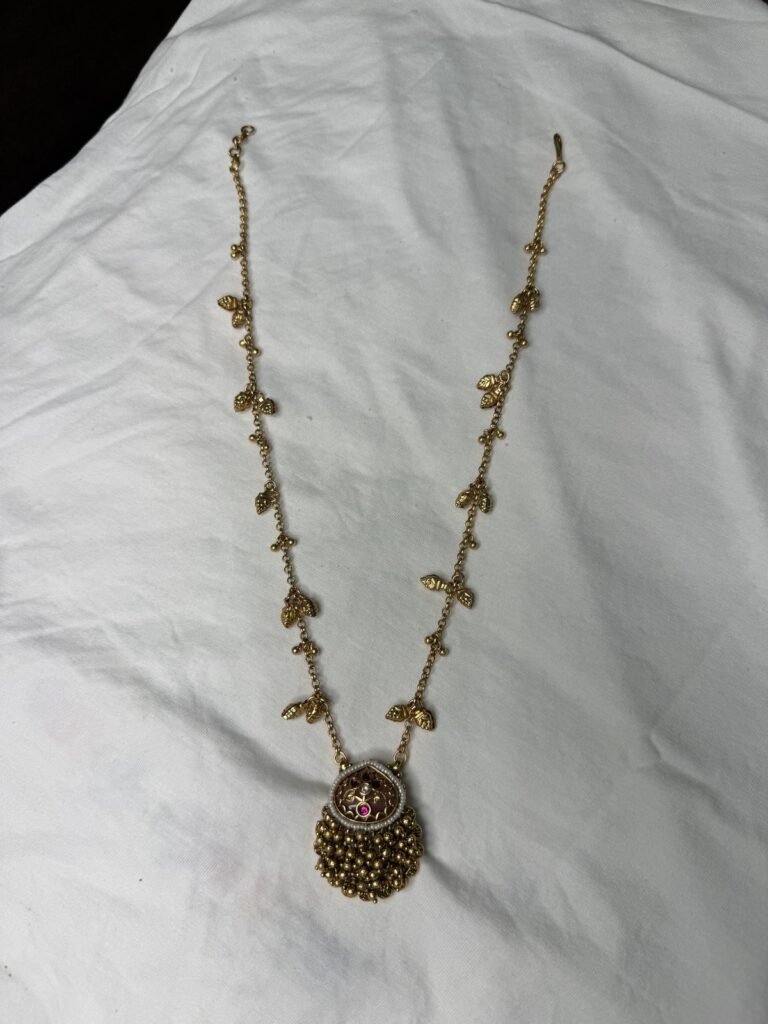 Elegant Gold-Toned Necklace Set with Pink Stone Pendant and Matching Earrings