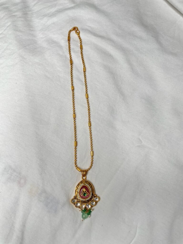 Traditional Golden Pendant Set with Red Stone and Green Beads
