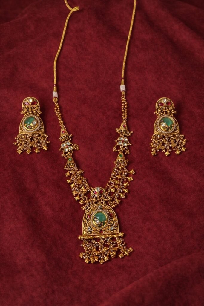 Traditional Gold-Toned Kundan Necklace Set with Green Stone Embellishments