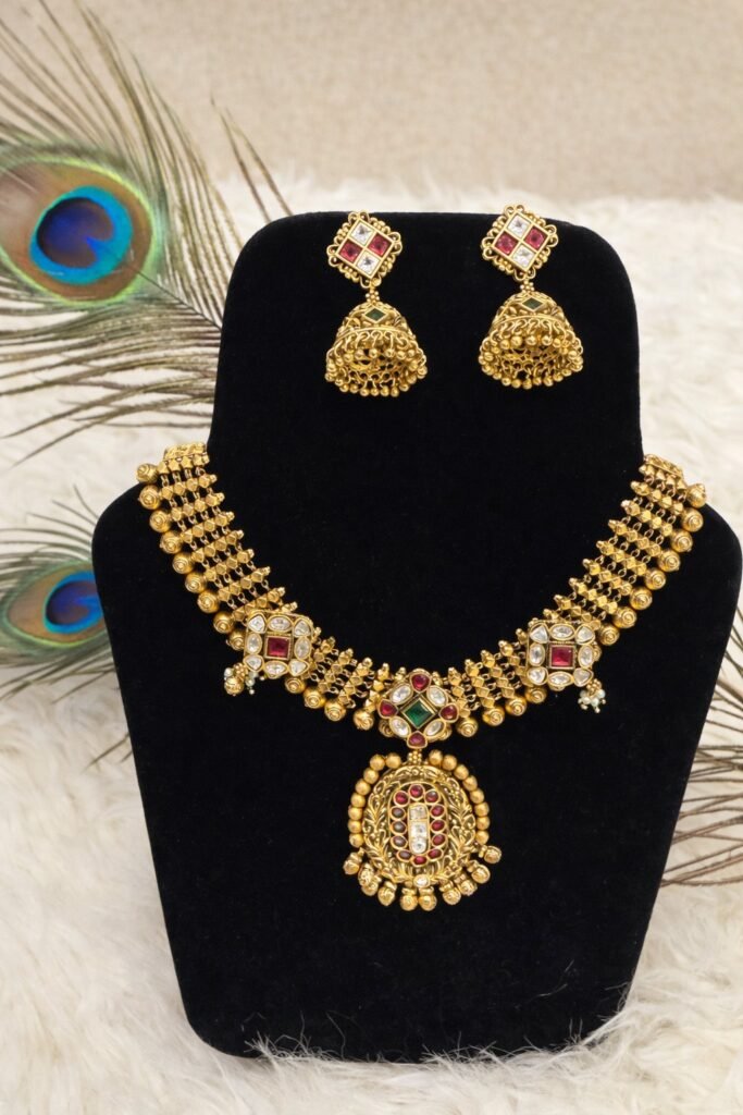 Traditional Gold-Toned Temple Jewellery Necklace Set with Jhumka Earrings