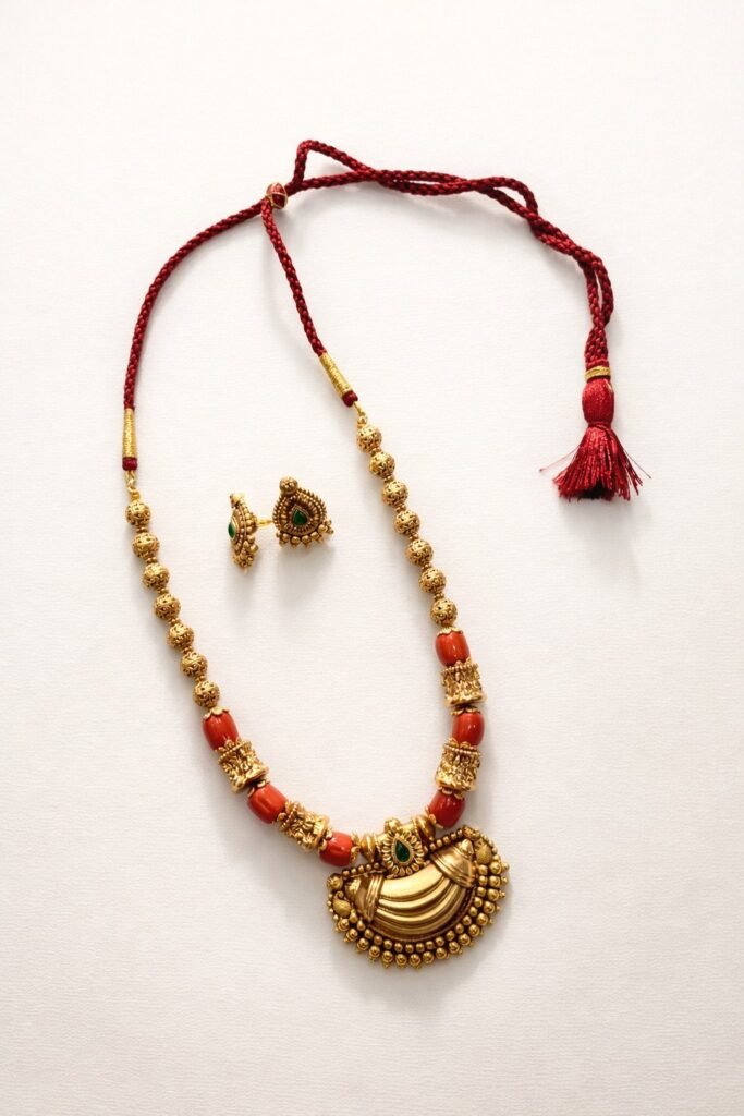 Traditional Gold-Toned Necklace Set with Red Thread and Matching Earrings