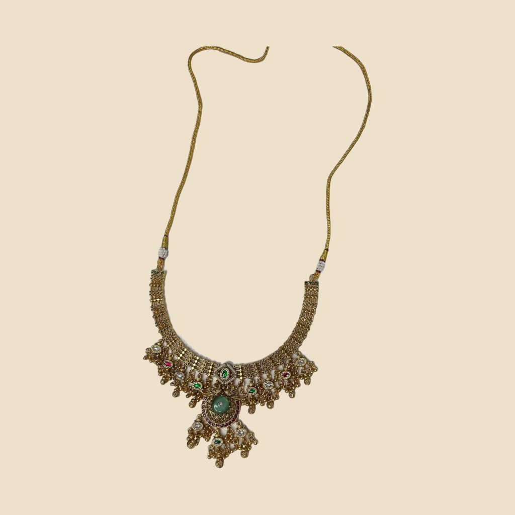 Traditional Gold-Plated Kundan Necklace Set with Green Stones and Matching Earrings