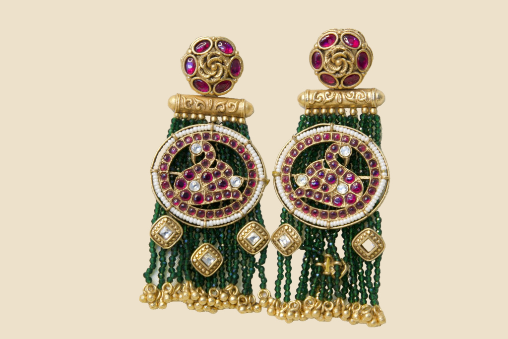 Traditional Kundan and Bead Tassel Earrings with Green Beads and Pink Gemstone Design
