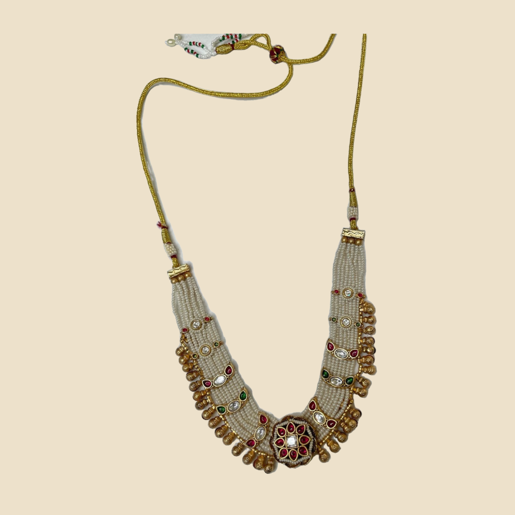 Traditional Pearl Beaded Necklace Set with Kundan and Gemstone Detailing