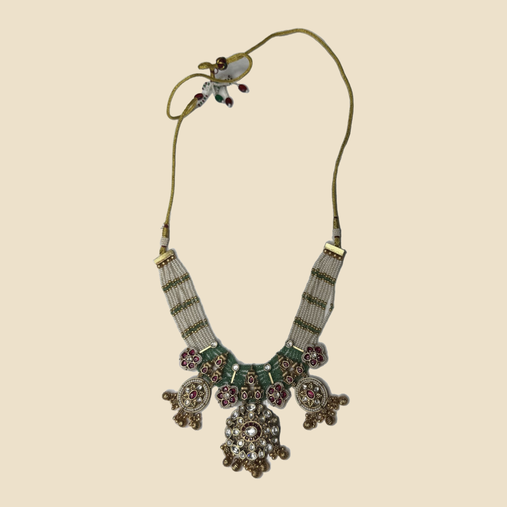 Traditional Kundan Style Pearl Beaded Necklace and Earring Set with Red and Green Stones