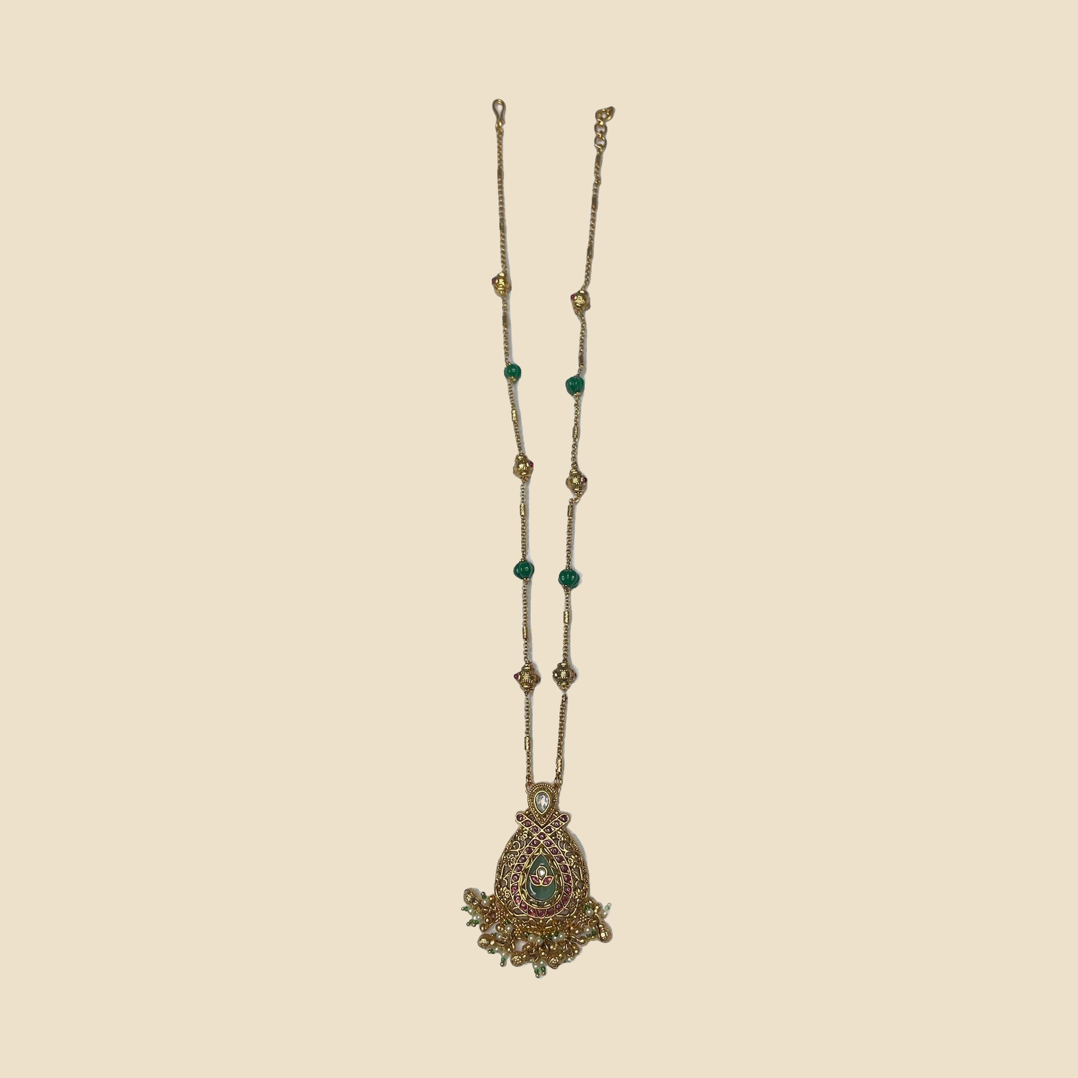 Golden Kundan Necklace Set with Green Beads and Matching Earrings