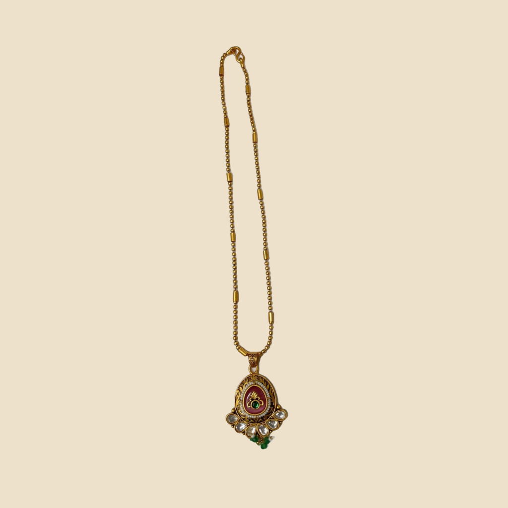 Traditional Golden Pendant Set with Red Stone and Green Beads