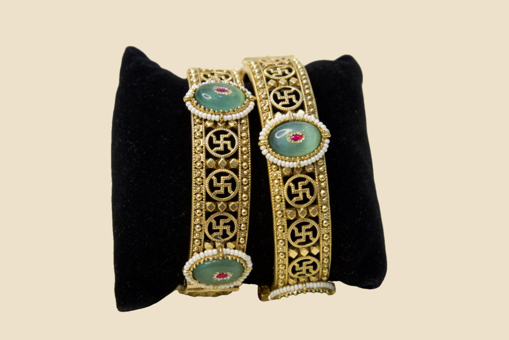 Traditional Gold-Toned Bangles with Green Stone Embellishments
