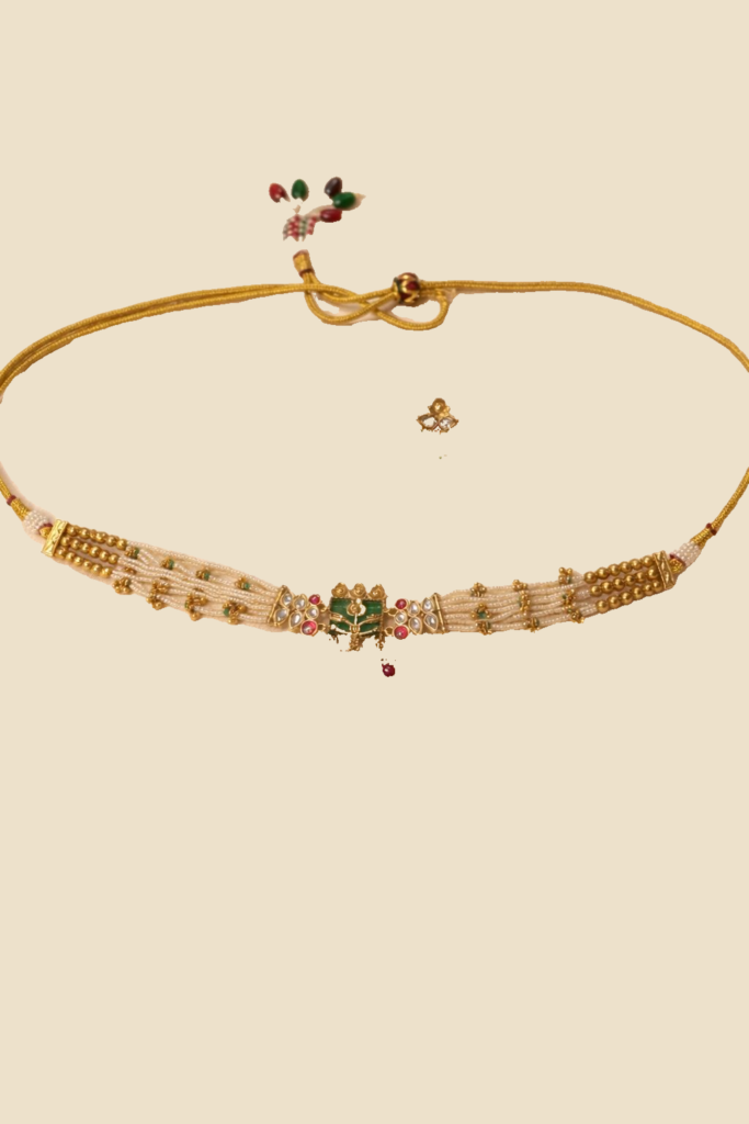 Traditional Gold-Toned Kundan Necklace Set with Green and Red Stone Embellishments