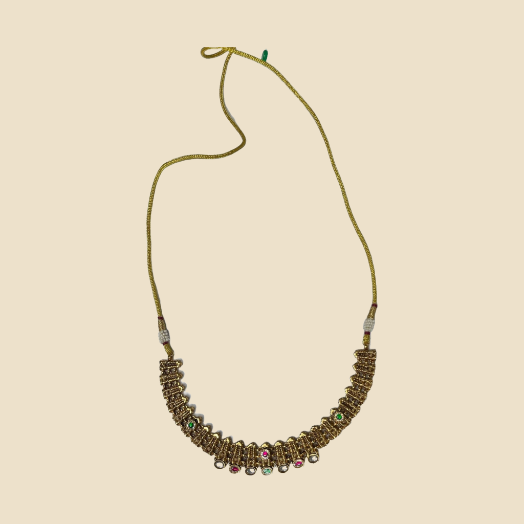 Gold-Toned Necklace and Jhumka Earrings Set with Pink and Green Stone Embellishments