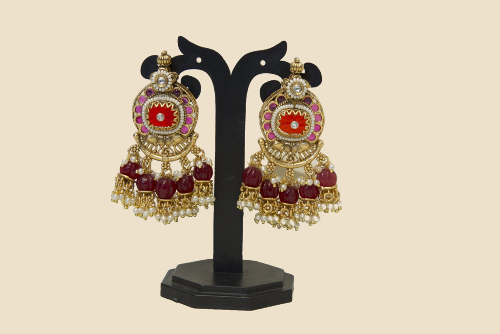 Traditional Gold-Toned Jhumka Earrings with Red and Pearl Embellishments
